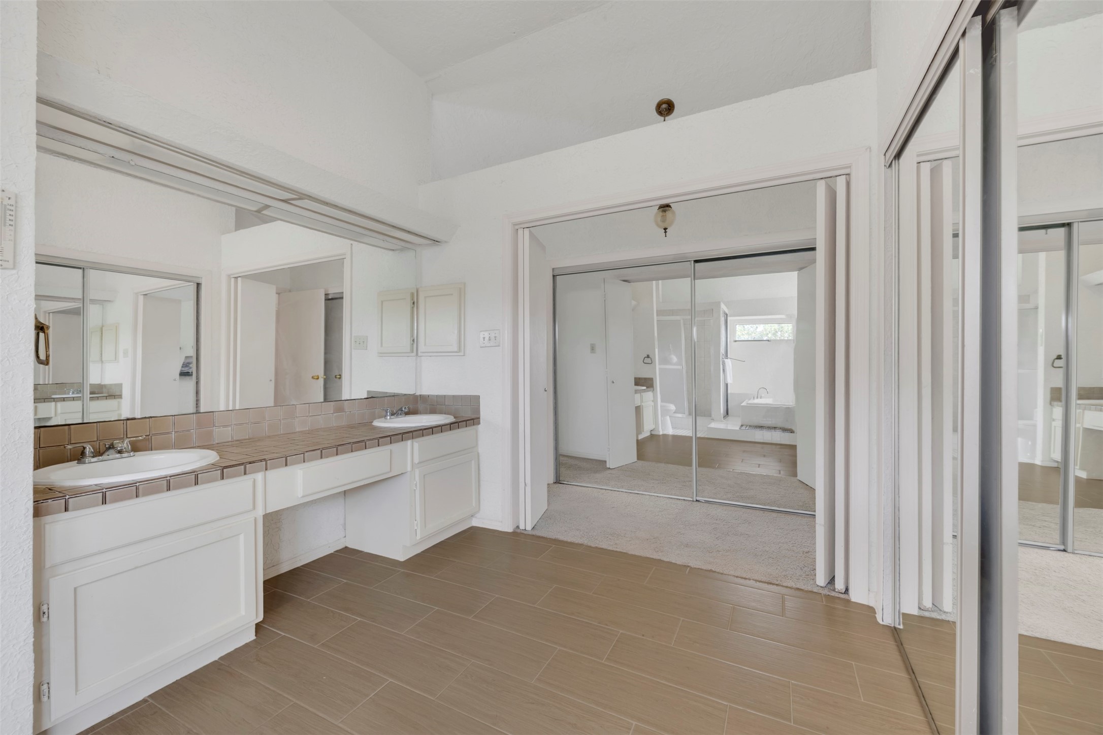 15619 Beechnut Street Houston, TX 77083 - Photo 23 of 29 Enjoy a relaxing retreat with a soaking tub, separate shower, and private water closet.