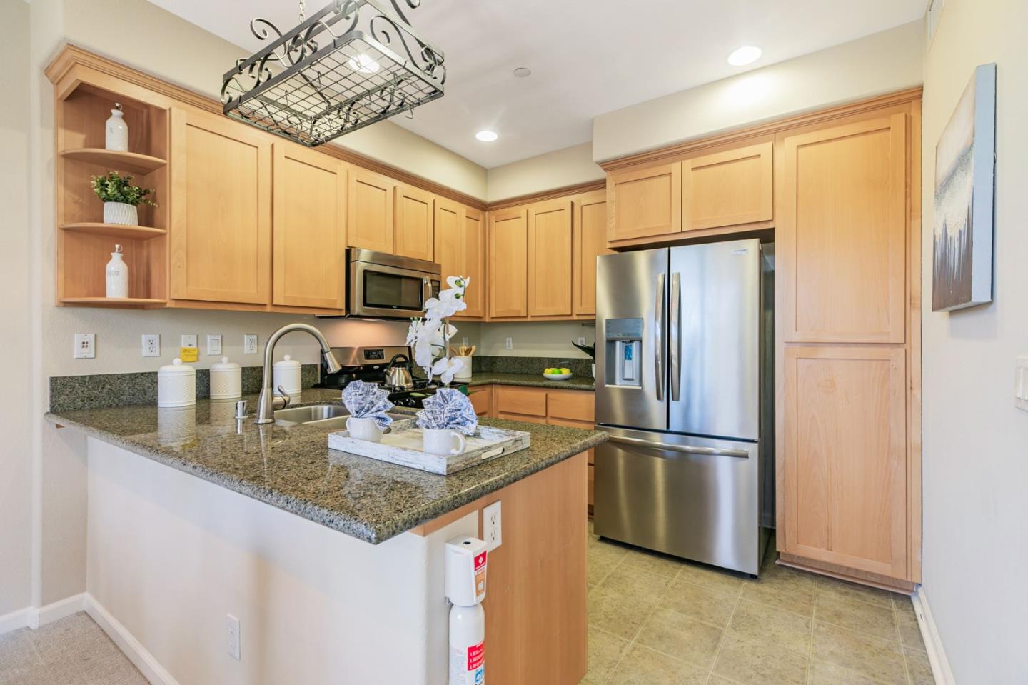 2070 Almaden Road San Jose, CA 95125 - Photo 16 of 49 a kitchen with stainless steel appliances granite countertop a refrigerator a stove a sink a oven with a dining table and chairs