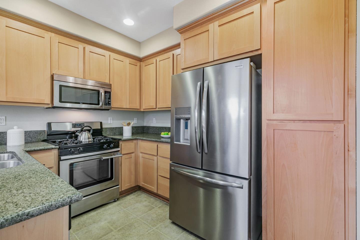 2070 Almaden Road San Jose, CA 95125 - Photo 17 of 49 a kitchen with stainless steel appliances granite countertop a refrigerator stove a sink and a microwave