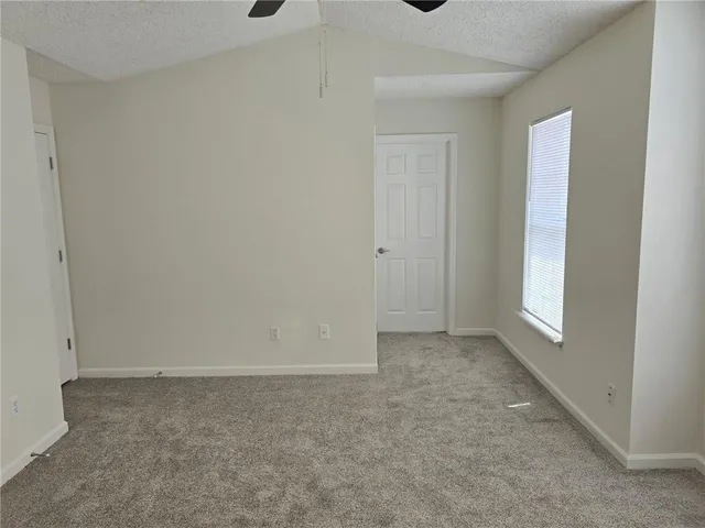 a view of an empty room and window