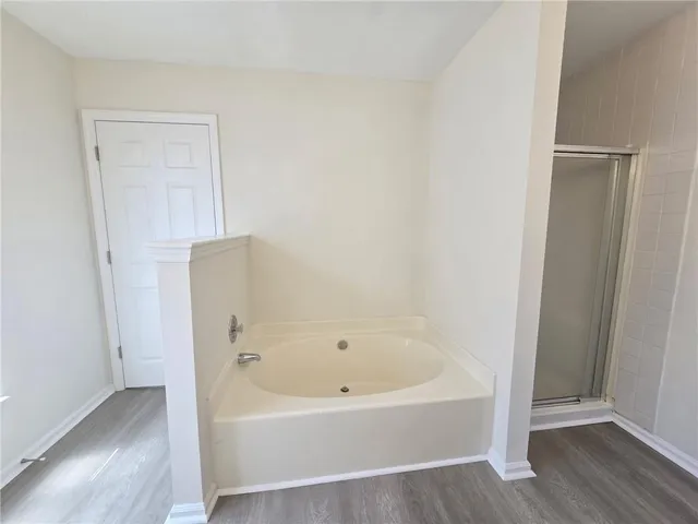 a white bath tub sitting in a bathroom