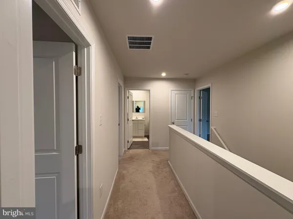 a view of storage and utility room with washer and dryer