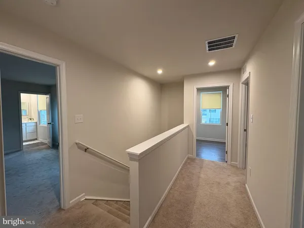 a view of hallway with livingroom