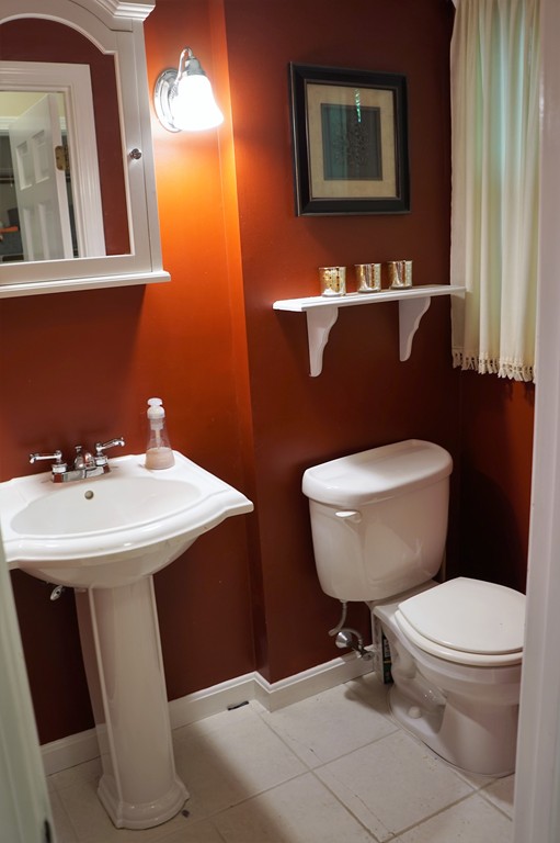 6 Pinewood Road Chelmsford, MA 01824 - Photo 14 of 27 a bathroom with a toilet a sink and mirror