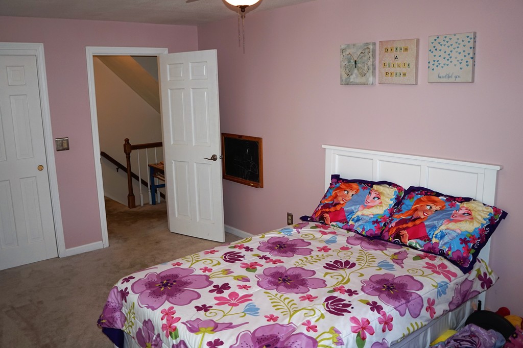 6 Pinewood Road Chelmsford, MA 01824 - Photo 19 of 27 a bedroom with a bed and a lamp