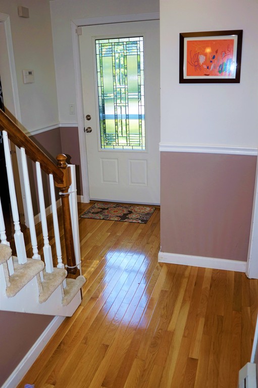 6 Pinewood Road Chelmsford, MA 01824 - Photo 2 of 27 a view of an empty room with wooden floor and a window