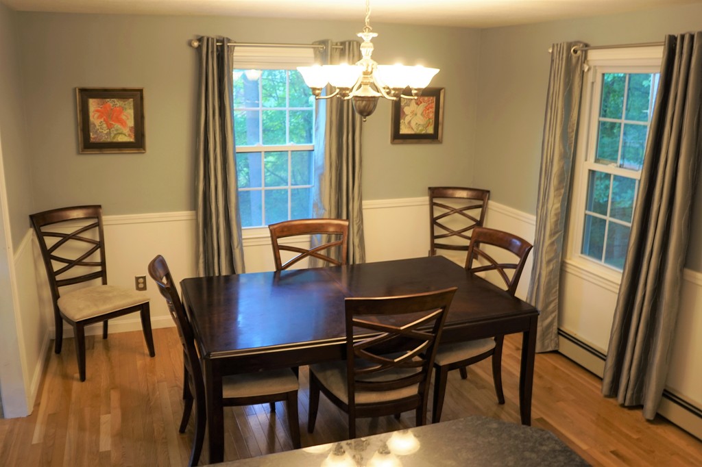 6 Pinewood Road Chelmsford, MA 01824 - Photo 7 of 27 a view of a dining room with furniture and wooden floor