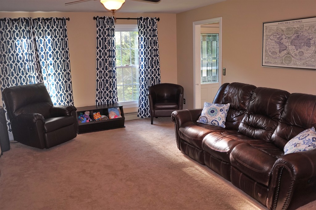 6 Pinewood Road Chelmsford, MA 01824 - Photo 10 of 27 a living room with furniture and a large window