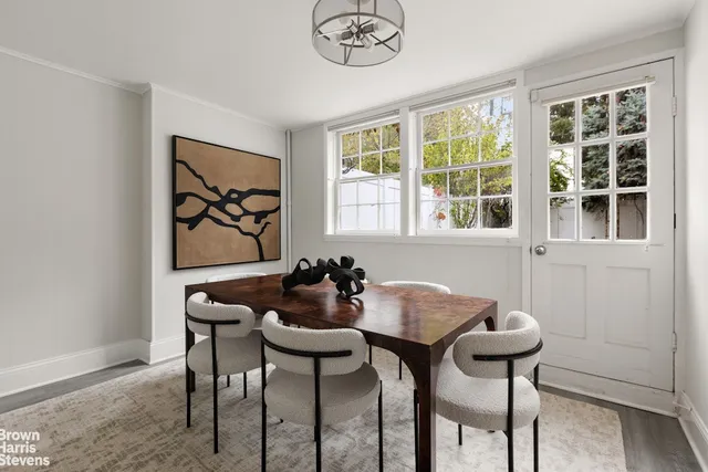 a kitchen with cabinets wooden floor and a counter top space