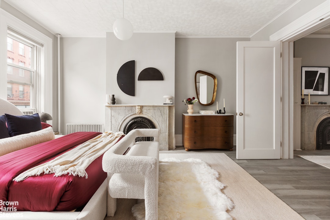 91 Berry Street Brooklyn, NY 11249 - Photo 3 of 14 a bedroom with bed and a window