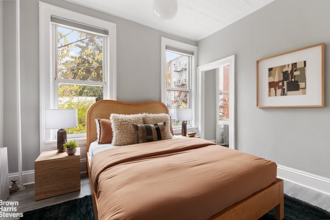 91 Berry Street Brooklyn, NY 11249 - Photo 5 of 14 a bedroom with bed and a window
