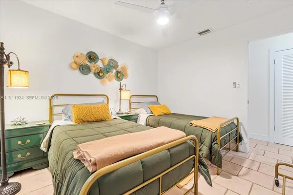 a bathroom with a sink vanity mirror and toilet