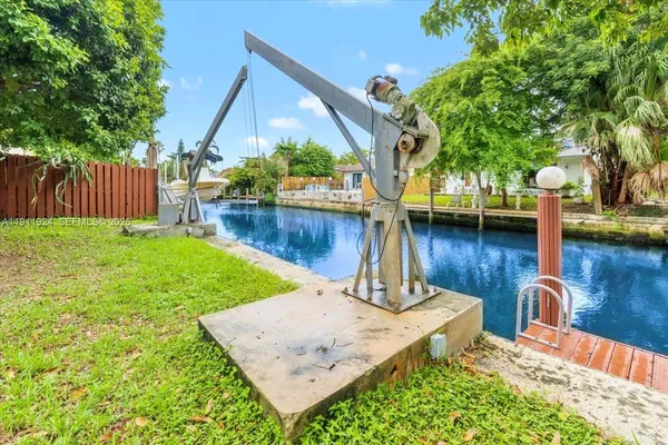 a view of a backyard with plants and patio