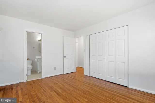 a view of a room with wooden floor