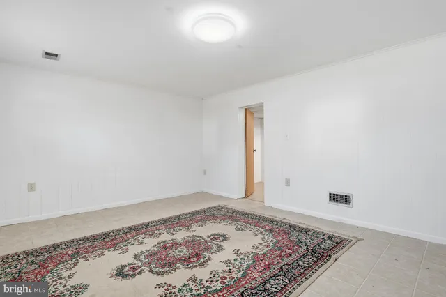 a utility room with cabinets washer and dryer