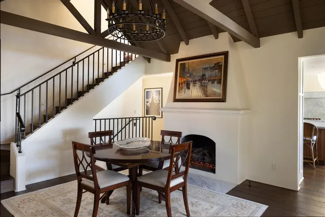 a view of a dining room with furniture wooden floor and front door