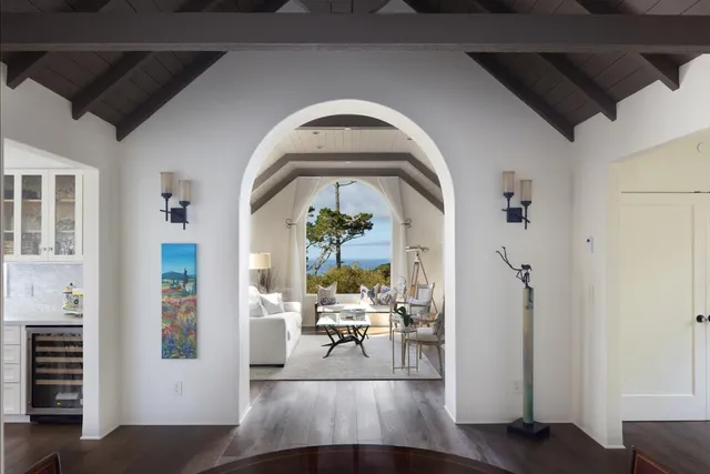 a view of living room with furniture and wooden floor