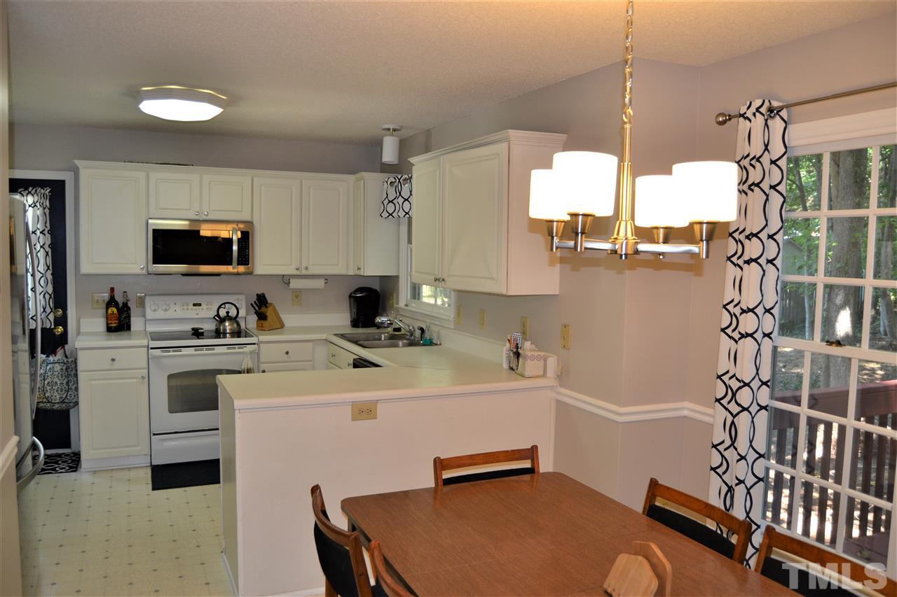 3537 Dechart Lane Raleigh, NC 27616 - Photo 4 of 21 a kitchen with a sink appliances and cabinets