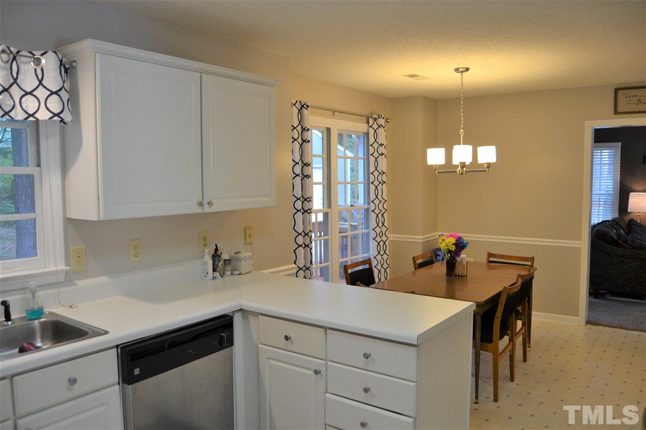 3537 Dechart Lane Raleigh, NC 27616 - Photo 5 of 21 a kitchen with a sink cabinets and window