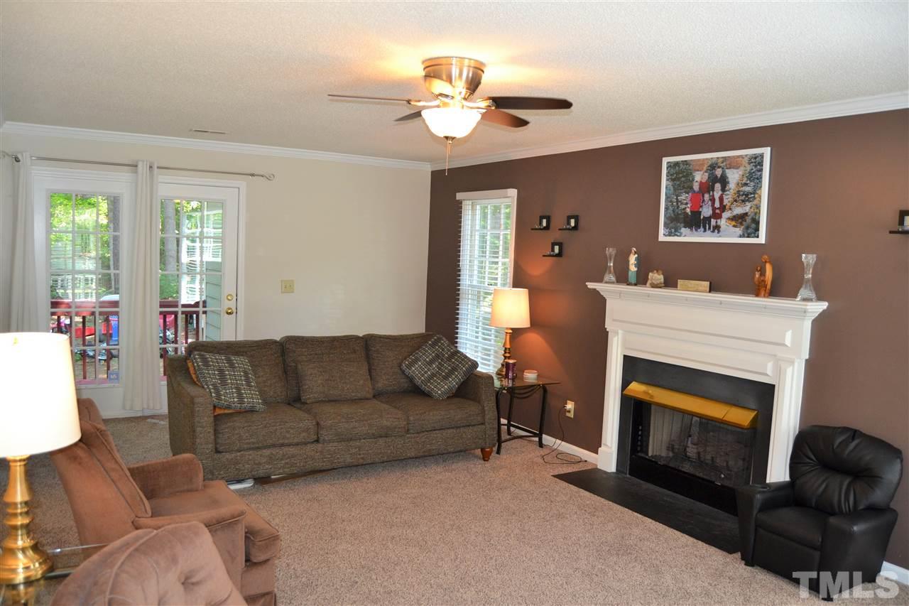 3537 Dechart Lane Raleigh, NC 27616 - Photo 8 of 21 a living room with furniture and a fireplace