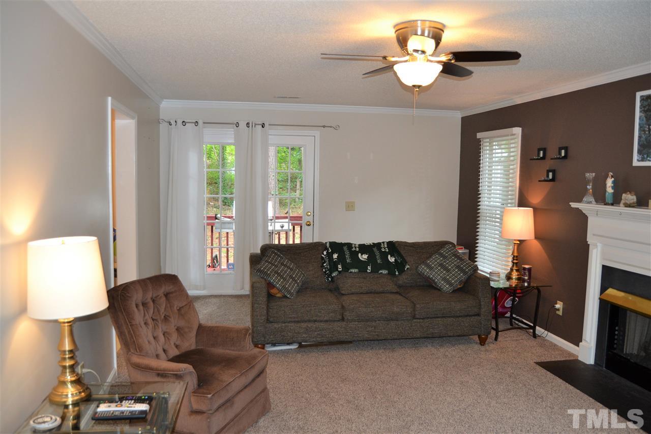 3537 Dechart Lane Raleigh, NC 27616 - Photo 9 of 21 a living room with furniture a lamp and a window