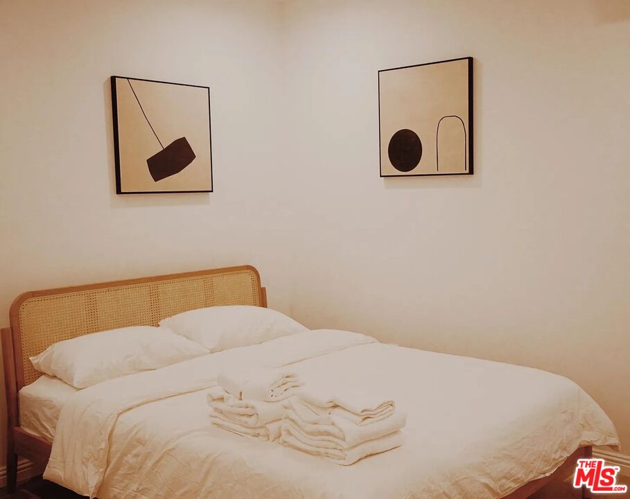 3318 Merced Street Los Angeles, CA 90065 - Photo 6 of 9 a bedroom with a bed and wall painting