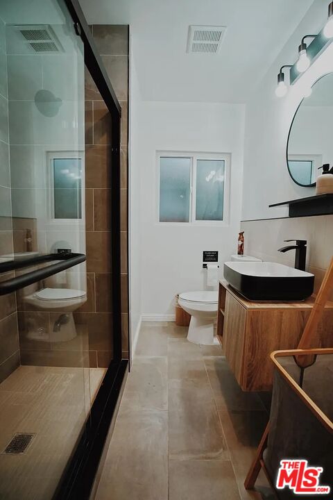 3318 Merced Street Los Angeles, CA 90065 - Photo 7 of 9 a bathroom with a sink and a mirror