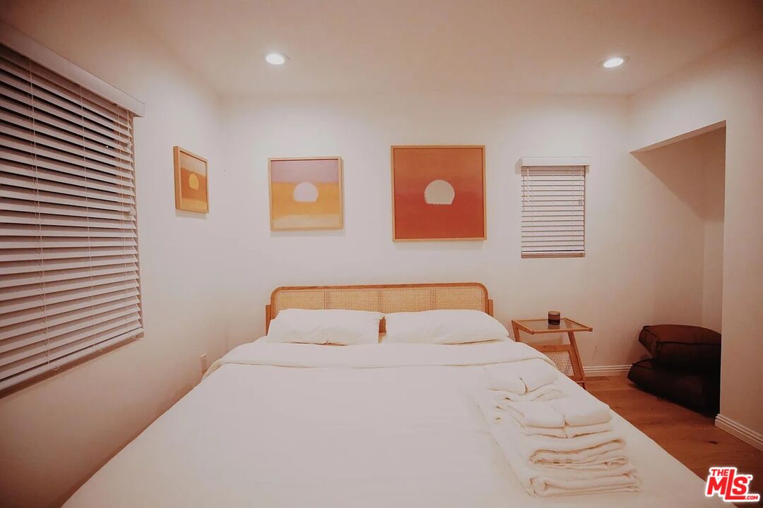 3318 Merced Street Los Angeles, CA 90065 - Photo 9 of 9 a bedroom with a bed and a large window