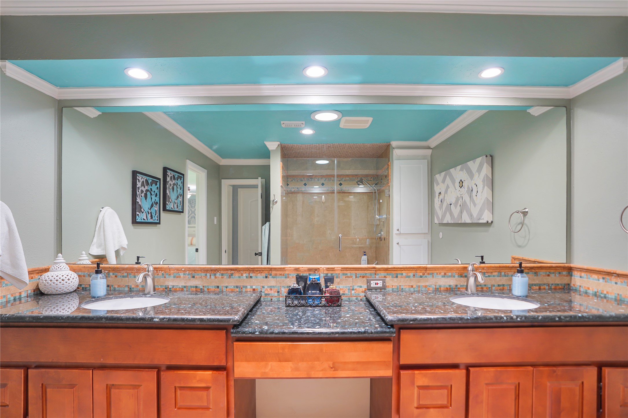 4920 Almeda Genoa Road Houston, TX 77048 - Photo 19 of 29 a bathroom with a granite countertop sink a mirror and shower