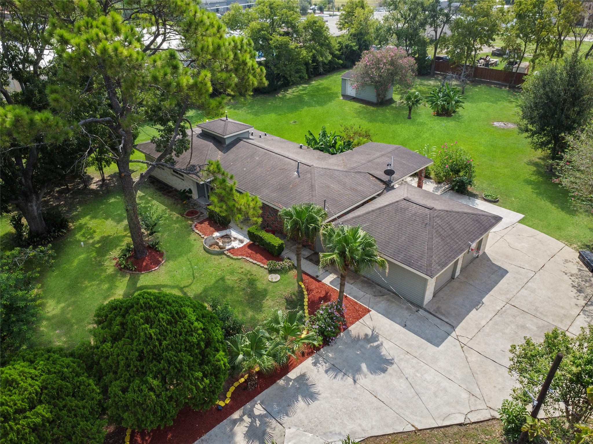 4920 Almeda Genoa Road Houston, TX 77048 - Photo 3 of 29 an aerial view of a house with a garden and trees