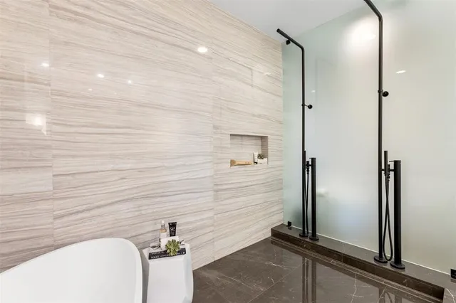 a view of a swimming pool with a table and chairs