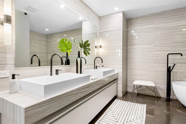 a view of a swimming pool with outdoor seating