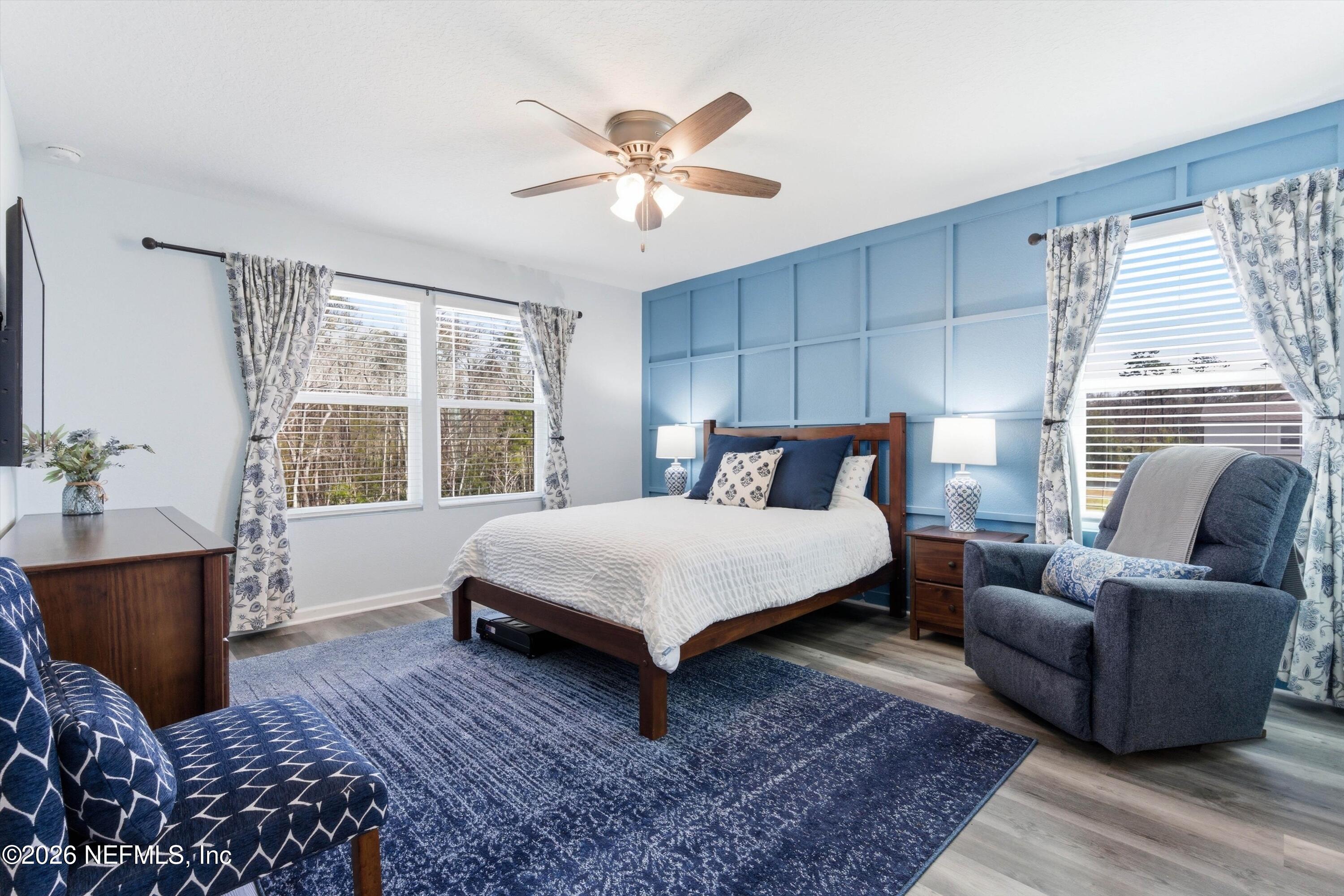 103 Seaport Breeze Road St. Augustine, FL 32095 - Photo 18 of 44 a bedroom with a large bed and a window
