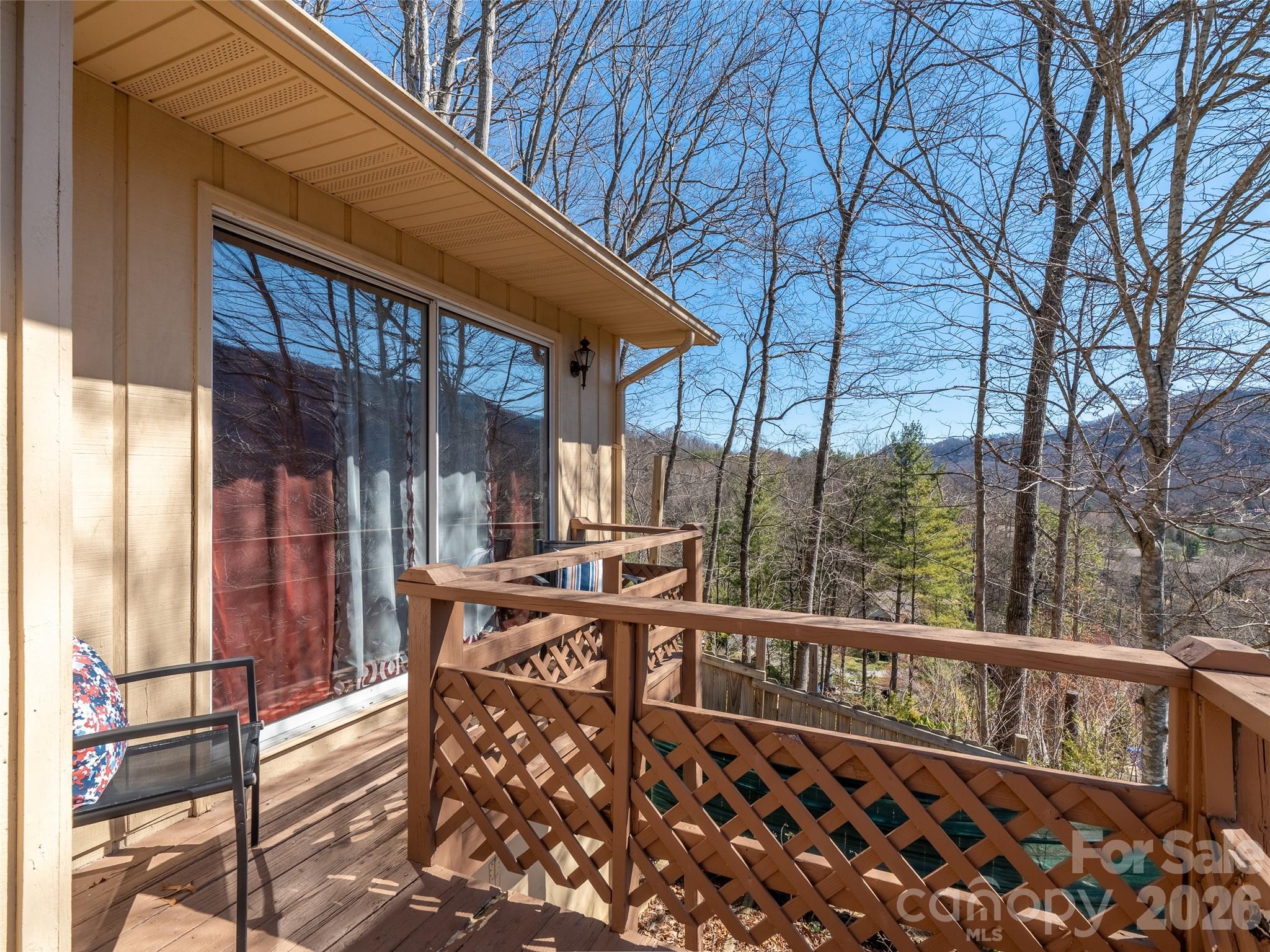 174 Pleasant Ridge Drive Maggie Valley, NC 28751 - Photo 13 of 45 a view of a chairs and tables in the balcony