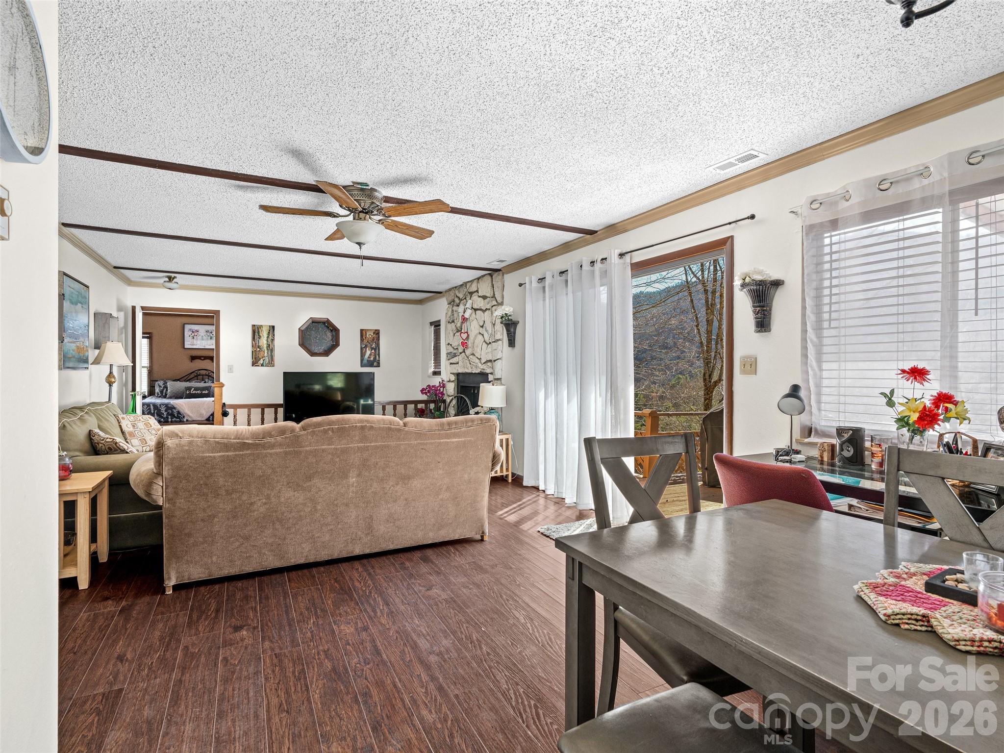 174 Pleasant Ridge Drive Maggie Valley, NC 28751 - Photo 19 of 45 a living room with furniture and a wooden floor