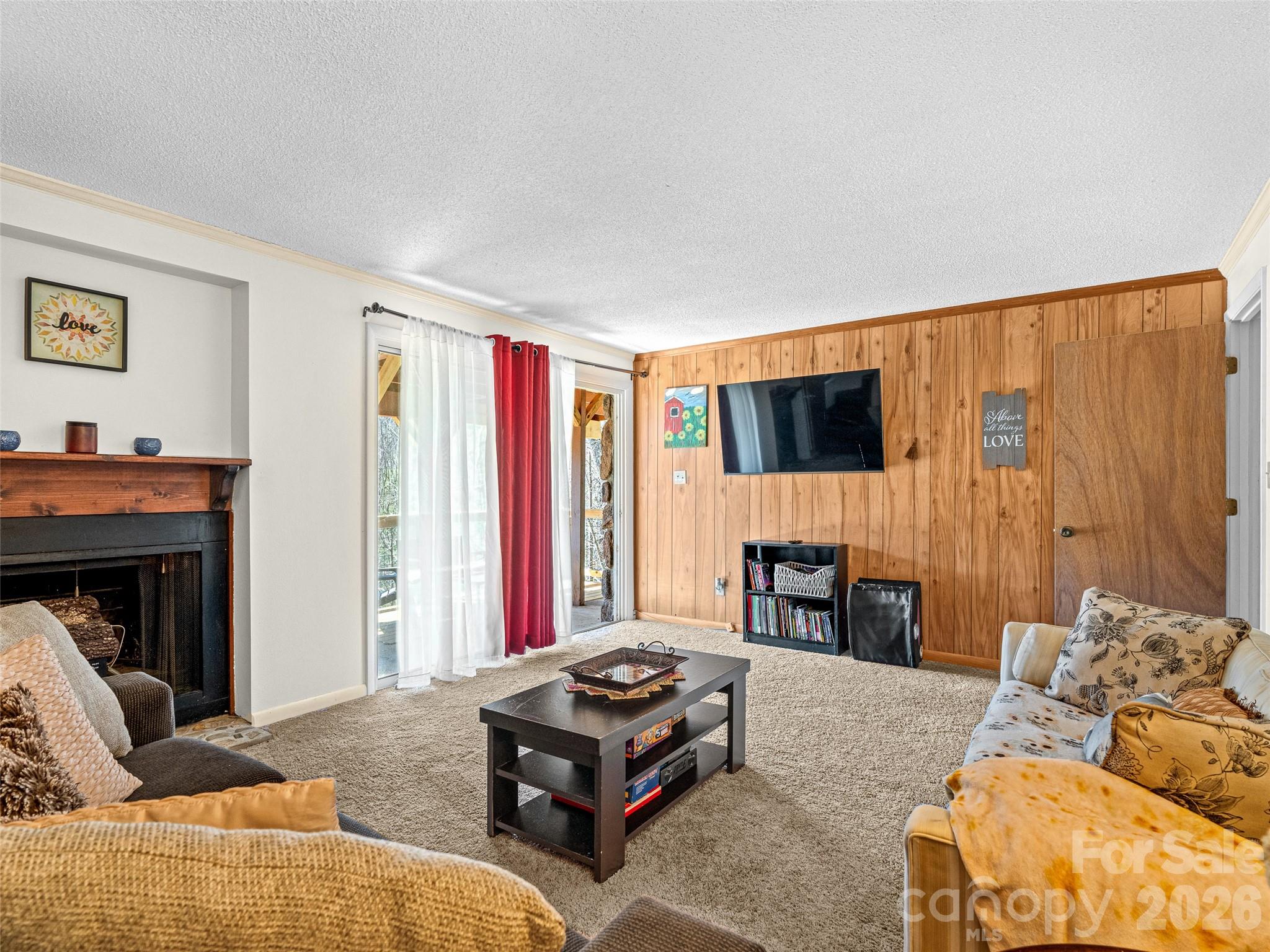 174 Pleasant Ridge Drive Maggie Valley, NC 28751 - Photo 31 of 45 a living room with furniture and a flat screen tv