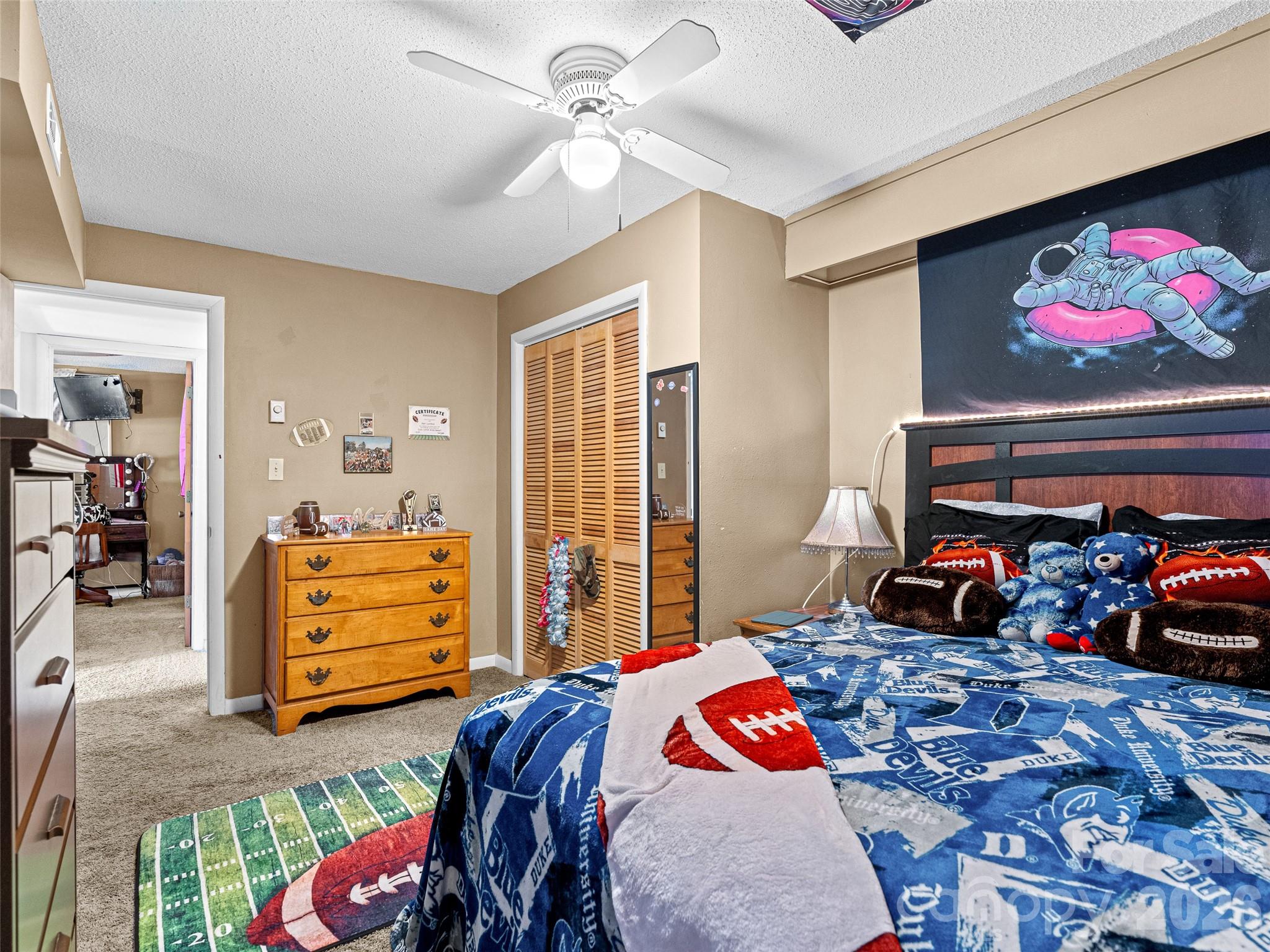 174 Pleasant Ridge Drive Maggie Valley, NC 28751 - Photo 33 of 45 a bedroom with a bed and dresser