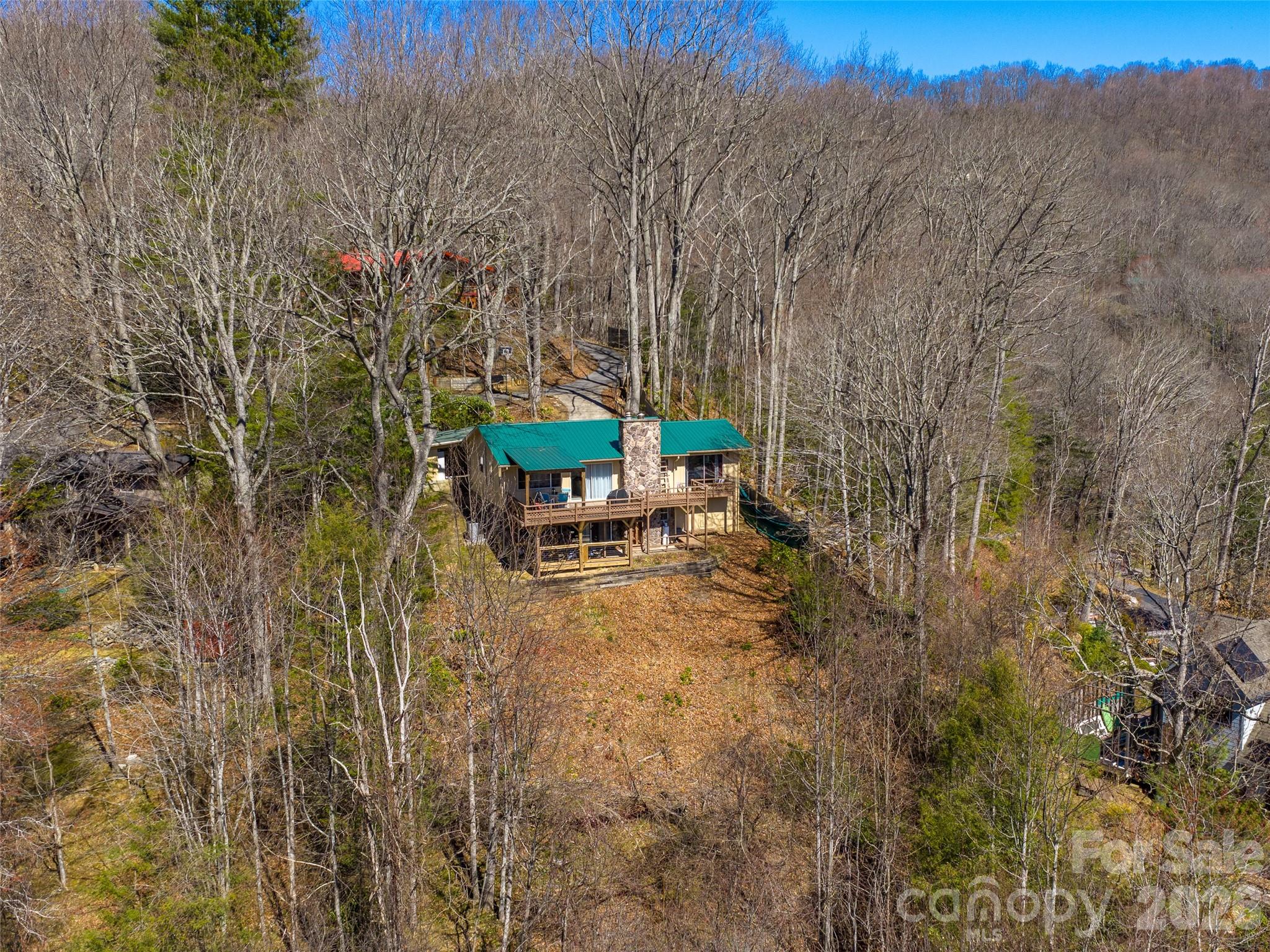 174 Pleasant Ridge Drive Maggie Valley, NC 28751 - Photo 40 of 45 a view of a backyard with sitting area