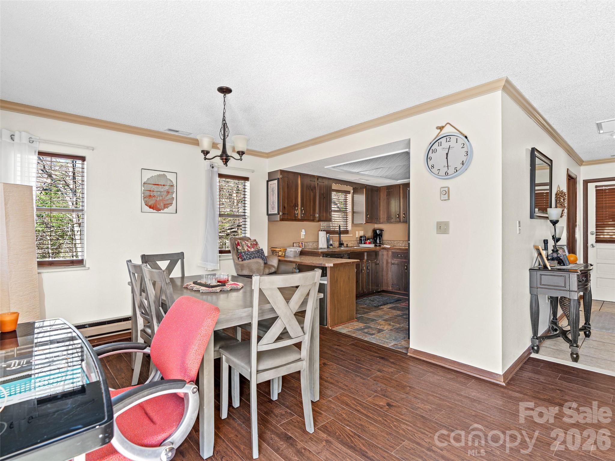 174 Pleasant Ridge Drive Maggie Valley, NC 28751 - Photo 8 of 45 a view of a dining room with furniture and wooden floor