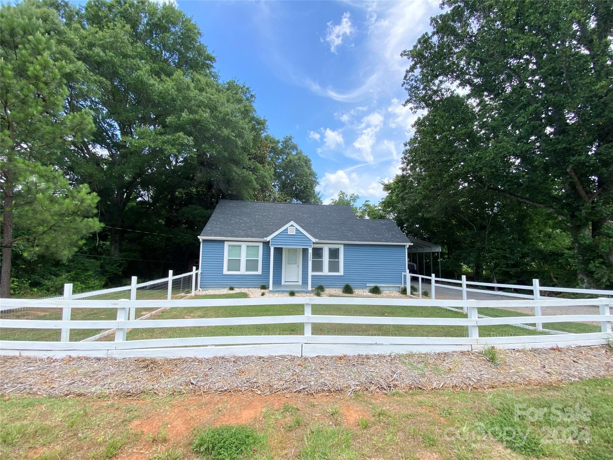 4250 Potneck Road Woodleaf, NC 27054 - Photo 1 of 36 a view of a house with a big yard