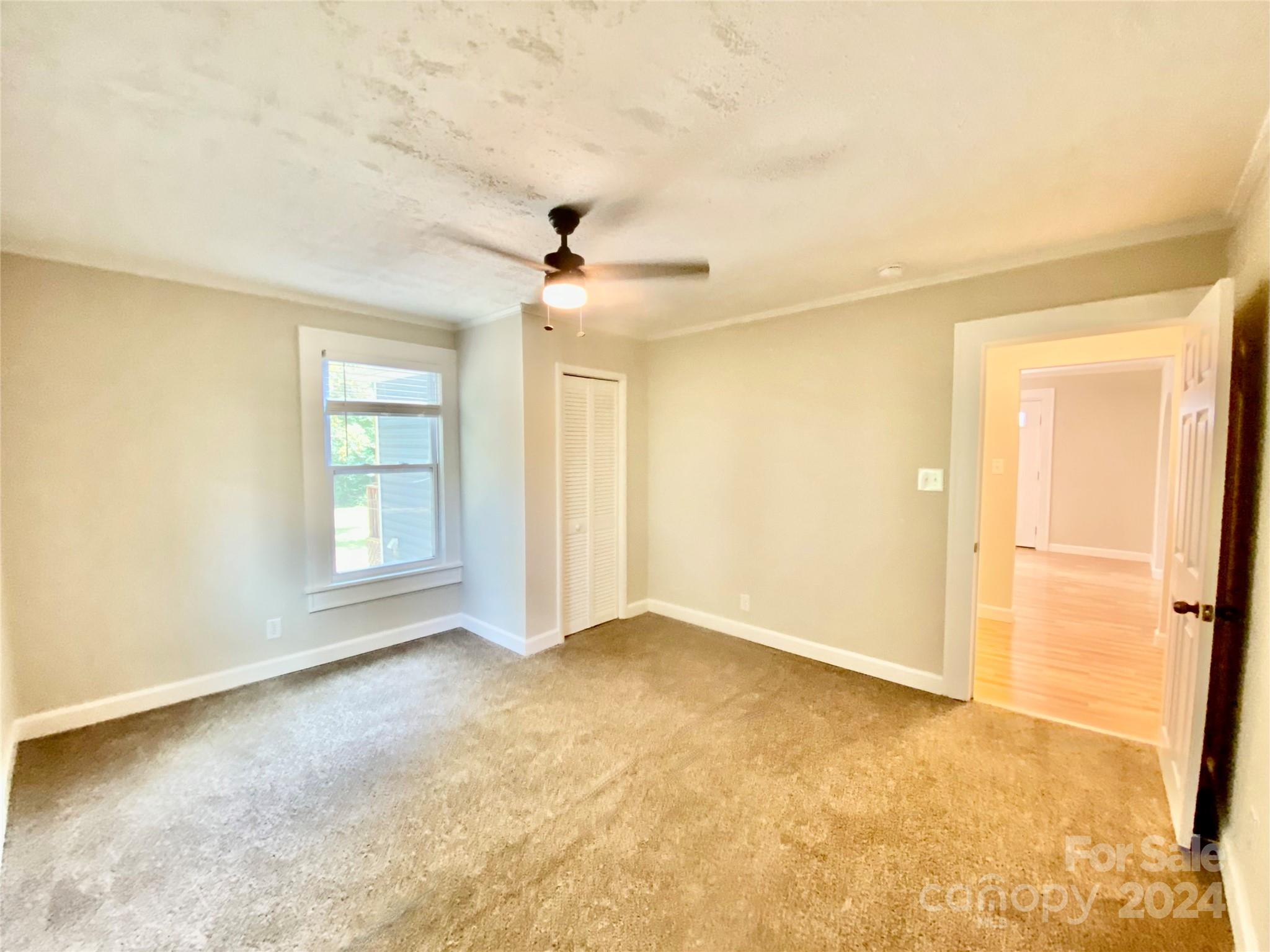 4250 Potneck Road Woodleaf, NC 27054 - Photo 30 of 36 wooden floor in an empty room with a window