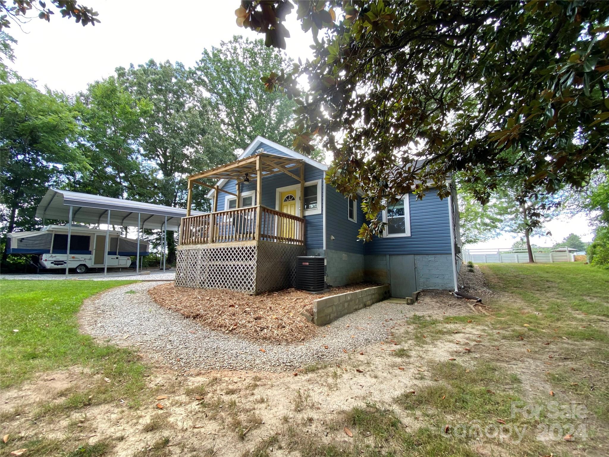 4250 Potneck Road Woodleaf, NC 27054 - Photo 10 of 36 a front view of a house with a yard