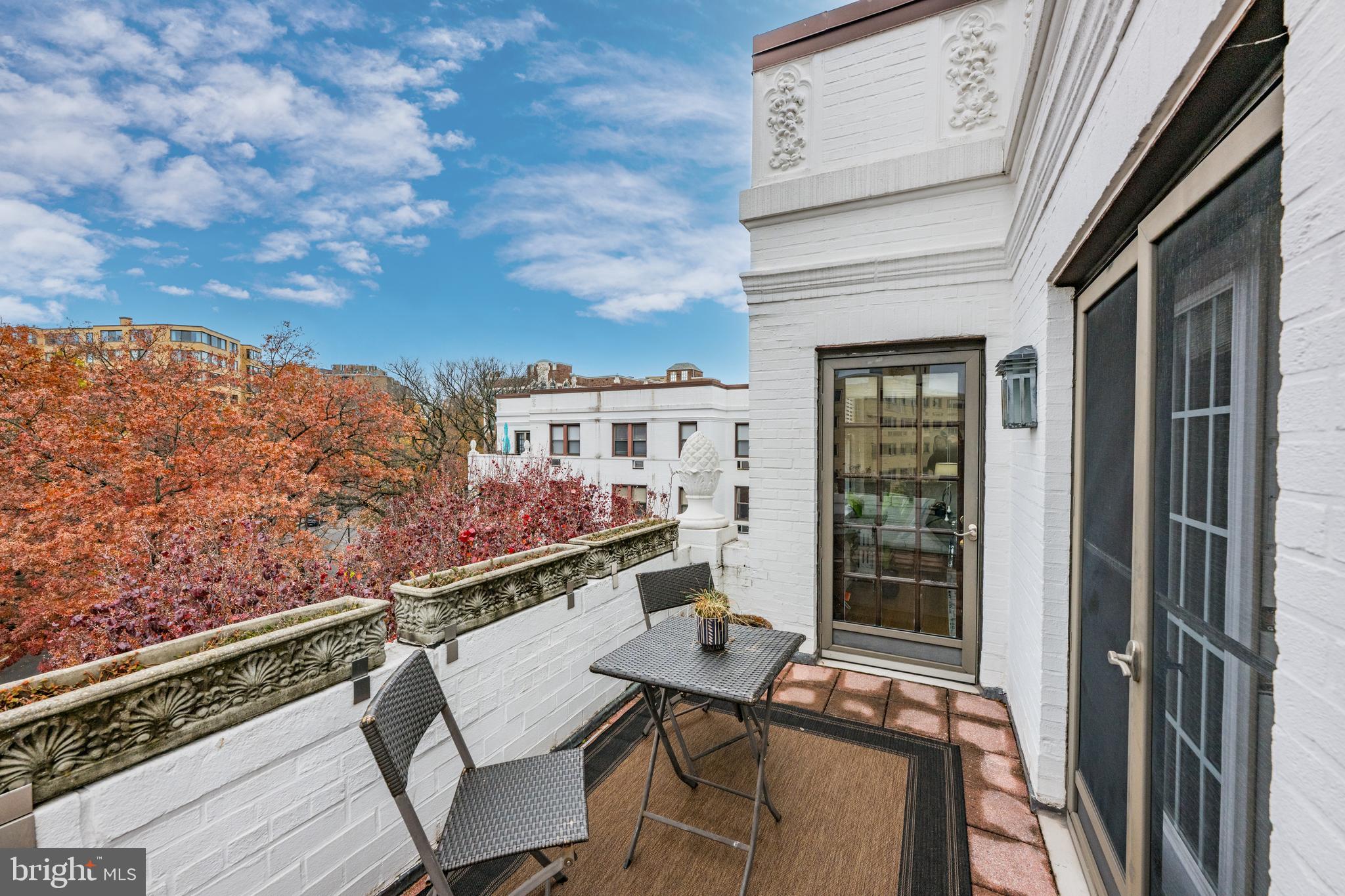 4701 Connecticut Avenue Northwest, Unit 501 Washington, DC 20008 - Photo 11 of 28 a balcony with table and chairs