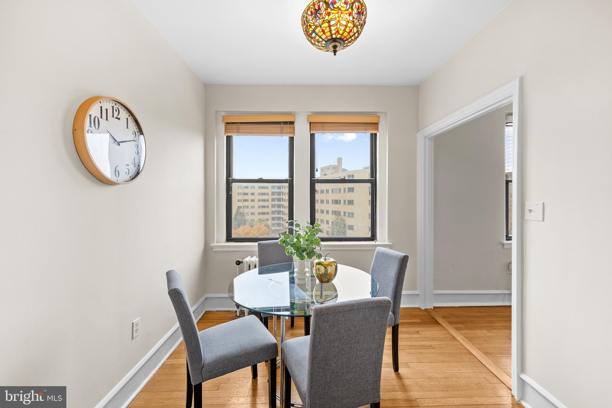 4701 Connecticut Avenue Northwest, Unit 501 Washington, DC 20008 - Photo 14 of 28 a view of a dining room with furniture and a window