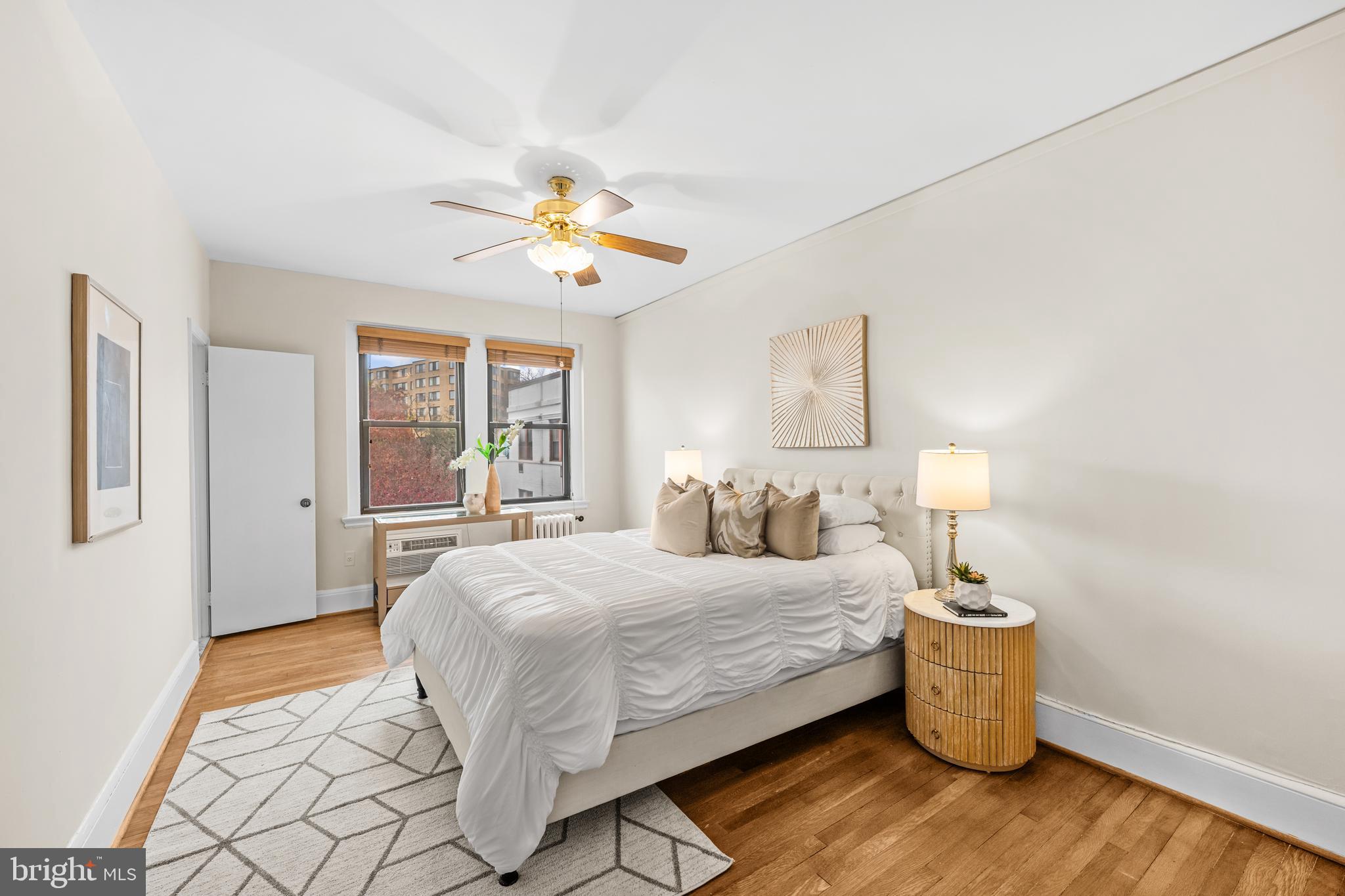 4701 Connecticut Avenue Northwest, Unit 501 Washington, DC 20008 - Photo 16 of 28 a bedroom with a bed and a chandelier