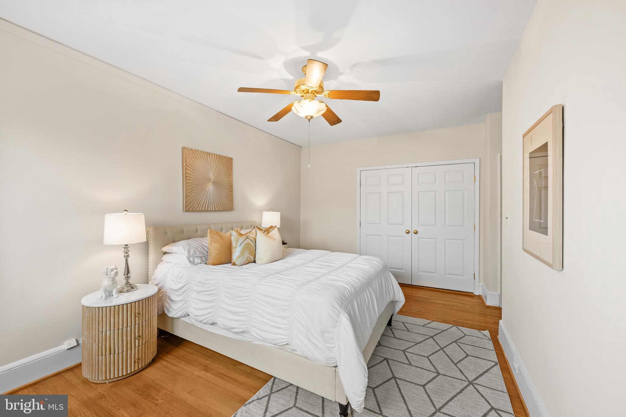 4701 Connecticut Avenue Northwest, Unit 501 Washington, DC 20008 - Photo 17 of 28 a bedroom with a bed and wooden floor