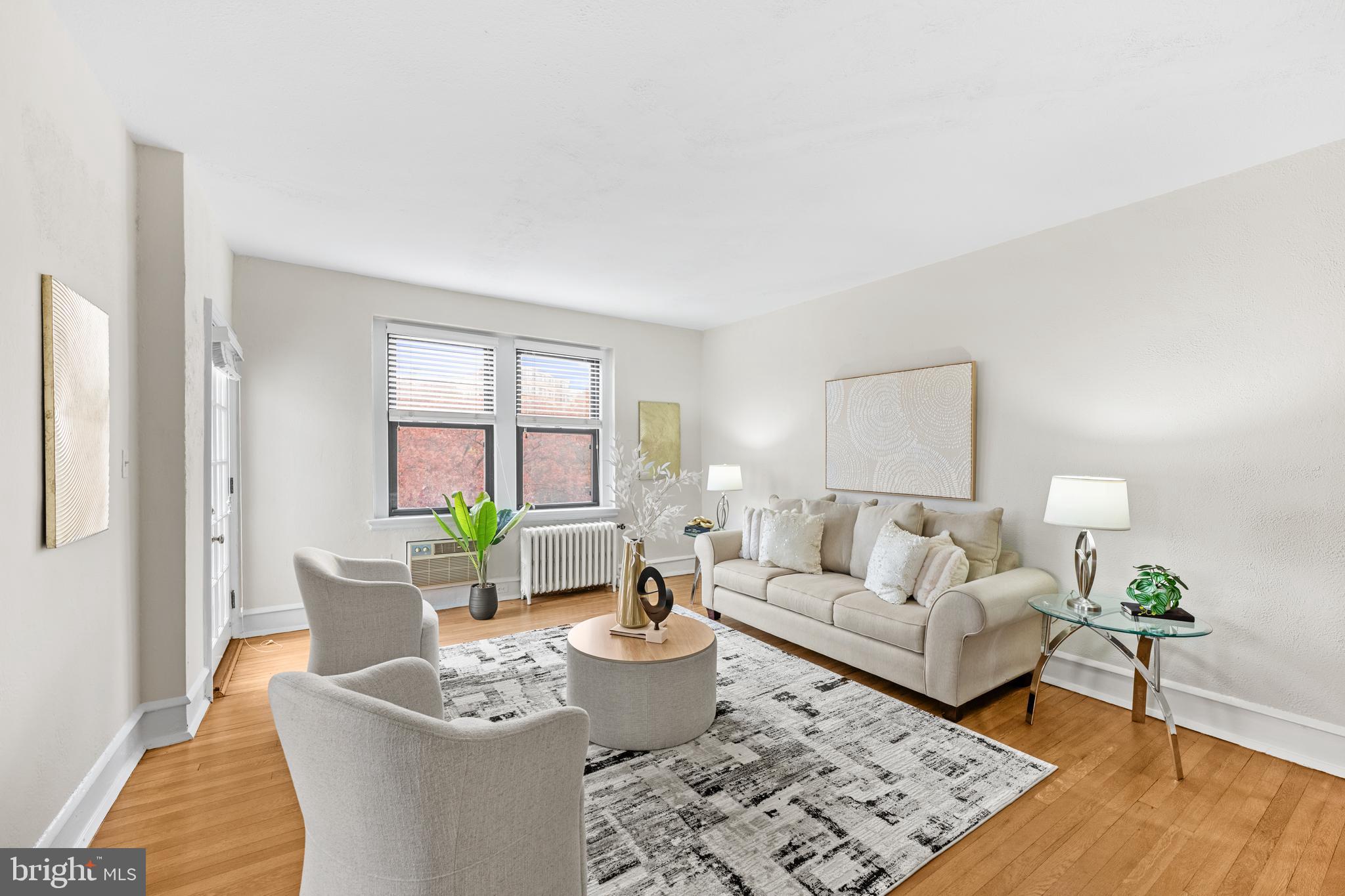 4701 Connecticut Avenue Northwest, Unit 501 Washington, DC 20008 - Photo 5 of 28 a living room with furniture and a window