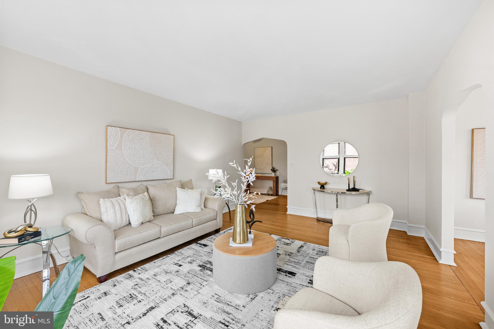 4701 Connecticut Avenue Northwest, Unit 501 Washington, DC 20008 - Photo 6 of 28 a living room with furniture and a lamp
