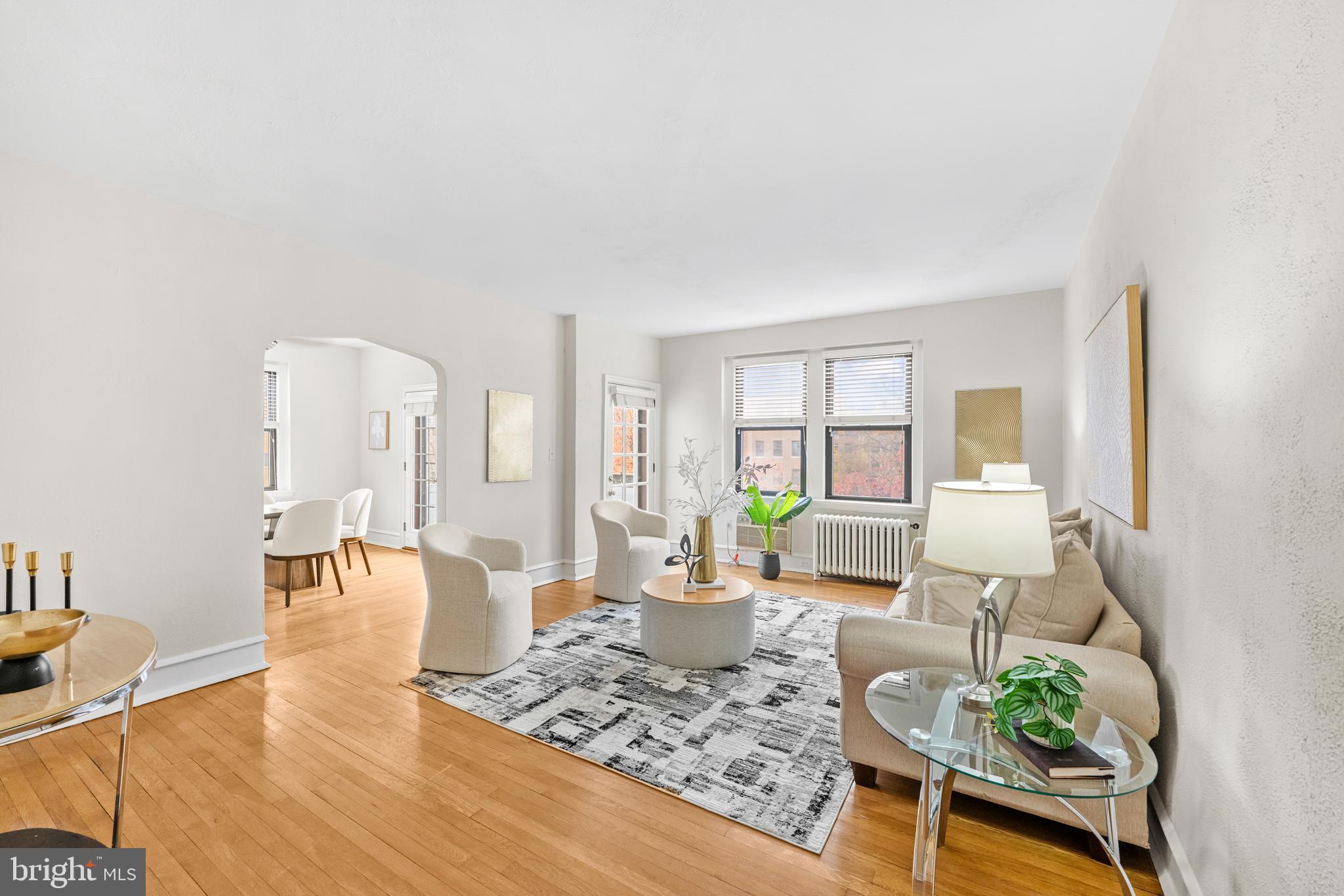 4701 Connecticut Avenue Northwest, Unit 501 Washington, DC 20008 - Photo 7 of 28 a living room with furniture and a table