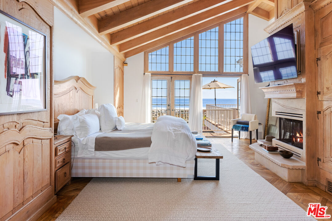 30870 Broad Beach Road Malibu, CA 90265 - Photo 11 of 28 a living room with furniture and a fireplace